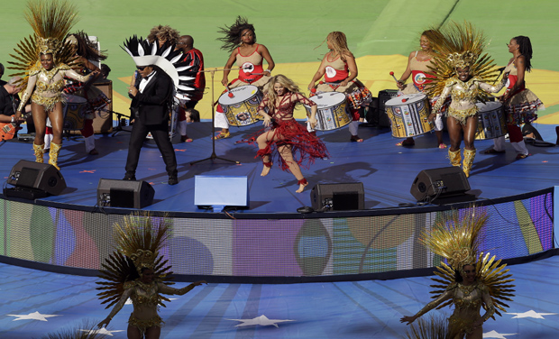 FIFA World Cup 2014: Colombian pop star Shakira, center in red, performs during the closing ceremony before the World Cup final soccer match between Germany and Argentina at the Maracana Stadium in Rio de Janeiro, Brazil (Photo: AP) FIFA World Cup 2014: Colombian pop star Shakira, center in red, performs during the closing ceremony before the World Cup final soccer match between Germany and Argentina at the Maracana Stadium in Rio de Janeiro, Brazil (Photo: AP)